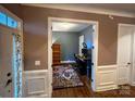 Inviting home office featuring hardwood floors, a desk, and a bookcase at 4006 Tremont Dr, Indian Trail, NC 28079
