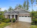 Beautiful single-story home with stone facade, two-car garage, and manicured front yard at 4008 Leyland Ct, Charlotte, NC 28227