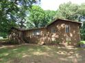 Charming brick home with mature trees providing shade and curb appeal at 4476 Nc Hwy 200 Rd, Stanfield, NC 28163