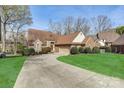 Beautiful home featuring a spacious driveway, attached garage, and well-maintained lawn at 5108 Tedorill Ln, Charlotte, NC 28226