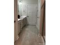 Elegant bathroom with double vanity, neutral walls, and tiled flooring at 934 Prince Garrett Way, Denver, NC 28037