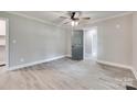 Clean, neutral bedroom with ceiling fan and hardwood-style flooring at 983 Willowbrook Ave, Rock Hill, SC 29730