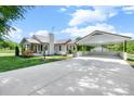 A well-maintained home with a large carport, offering ample parking and curb appeal at 1300 Nc 90 W Hwy, Taylorsville, NC 28681