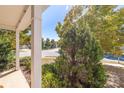 Inviting front porch view with lush greenery and a glimpse of the quiet neighborhood street at 2802 Azalea Hills Dr, Charlotte, NC 28262