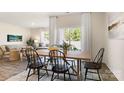 Bright dining room with large table, cozy seating, and natural light from sliding glass doors at 3019 Sassafras Trl, Gastonia, NC 28056