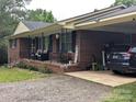 Brick home with covered porch and convenient carport provides ample parking and outdoor space at 3116 Pilgrim Rd, Chester, SC 29706