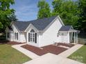 A picturesque rear view highlighting the architectural design and landscaping of the house at 7122 Marlin St, Gastonia, NC 28056