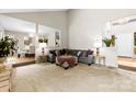 Comfortable living room with plush seating and view of the dining area at 9013 St Croix Ln, Charlotte, NC 28277