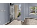 An inviting entryway with hard surface floors and a view of the exterior through the open door at 112 St Vincent Pl, Mount Holly, NC 28120
