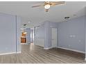 Open-concept living area with modern lighting, fresh paint and durable gray flooring at 112 St Vincent Pl, Mount Holly, NC 28120