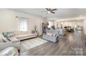 Spacious living room with hardwood floors and an open floor plan to the kitchen at 131 Swink Sw St, Concord, NC 28027