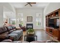 Bright living room features hardwood floors, fireplace, and natural light at 146 Burtons Barn Rd, Mooresville, NC 28115
