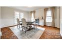 Bright dining room featuring stylish furniture, elegant curtains, and a built-in bar area with a wine cooler at 1581 Granville Rd, Rock Hill, SC 29732
