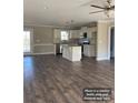 Spacious open-concept kitchen featuring a center island, stainless steel appliances, and ample counter space at 1669 California Rd, York, SC 29745