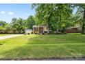 Charming home featuring mature trees and a well-manicured lawn at 206 Pelham Ln, Fort Mill, SC 29715