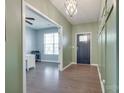 Welcoming foyer with hardwood floors, modern lighting, and easy access to the home office at 217 Barberry Dr, Belmont, NC 28012
