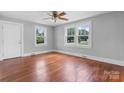 Bright bedroom featuring gleaming wood floors, neutral paint, a ceiling fan and abundant natural light at 2336 32Nd Ne St, Hickory, NC 28601