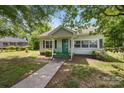 A single-story home with a classic design and a well-maintained lawn, exuding comfort and charm at 304 Miller Ave, Salisbury, NC 28144