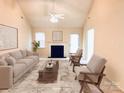 Staged living room boasting neutral walls, a fireplace, and carpet floors, offering a cozy and inviting space at 318 Linsbury Ct, Gastonia, NC 28056
