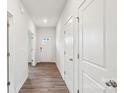 Neutral hallway with hard surface floors, neutral walls, and access to rooms at 4016 Cramer Estates Ct, Gastonia, NC 28056
