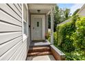 Covered front porch with brick steps and siding at 509 W Sixth Ave, Gastonia, NC 28052