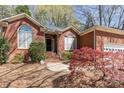 Charming brick home with manicured landscaping and inviting front entrance at 5550 Monticello Nw Dr, Concord, NC 28027