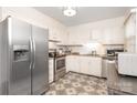 Bright kitchen featuring stainless steel appliances and decorative tile floor at 8306 Knights Bridge Rd, Charlotte, NC 28210