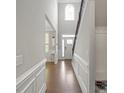 Welcoming foyer with hardwood floors, chair rail, and a view into the living spaces at 8347 Dallas Bay Rd, Charlotte, NC 28278