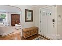 Foyer features hardwood floors, a decorative wooden chest, and a mirror above at 901 Scaleybark Rd, Charlotte, NC 28209