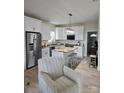 Bright eat-in kitchen with stainless steel appliances, granite countertops, and central island at 132 Swimmers Ln, Salisbury, NC 28146