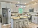Modern kitchen featuring stainless steel appliances, granite counters, and a center island at 132 Swimmers Ln, Salisbury, NC 28146