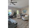 Open living room with ample natural light and luxury vinyl plank flooring throughout at 132 Swimmers Ln, Salisbury, NC 28146
