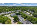 A lush residential neighborhood with well-maintained homes surrounded by mature trees and greenery, offering a serene environment at 1458 Bedlington Nw Dr, Charlotte, NC 28269