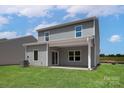 Relaxing covered patio in a spacious backyard, perfect for outdoor gatherings at 1512 Doran Ter, Richburg, SC 29729