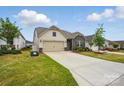 Beautifully landscaped single-Gathering home with a two-car garage and manicured lawn at 1825 Lotus Ln, Denver, NC 28037