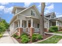 Charming two-story home with gray siding, brick accents, and a welcoming front porch at 1830 Wickford Pl, Charlotte, NC 28203