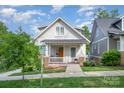 Charming home with welcoming front porch and manicured lawn at 1830 Wickford Pl, Charlotte, NC 28203