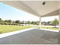 Inviting covered patio with a view of the front yard, perfect for enjoying the outdoors at 2046 Sabra St # Cwo0006, Gastonia, NC 28054