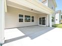 Relaxing covered patio area with concrete flooring and ample space for seating and outdoor enjoyment at 2046 Sabra St # Cwo0006, Gastonia, NC 28054
