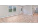 Inviting living room featuring hardwood flooring, neutral paint and double windows at 2511 Linwood Rd, Gastonia, NC 28052