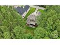 An aerial view of a well-maintained home with mature trees and a manicured lawn at 309 Palm Cove Way, York, SC 29745