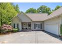 Attractive single-story home featuring well-maintained landscaping and a side-entry two-car garage at 327 Wilby Dr, Charlotte, NC 28270