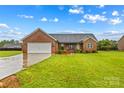 Charming single-story brick home with a well-manicured lawn and a two-car garage at 4336 Hunter Rhyne Rd # 9, Lincolnton, NC 28092