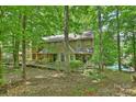 Attractive home exterior with a wooden walkway and lots of trees giving a sense of privacy at 6016 Gray Gate Ln # C, Charlotte, NC 28210