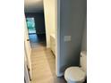 Bathroom view, showcasing stylish vanity and glimpse of bedroom with wood-look flooring at 8029 Cedar Glen Dr, Charlotte, NC 28212