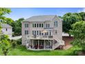Spacious backyard with multi-level deck, patio, and lush lawn perfect for outdoor living at 9433 Wallace Pond Dr, Huntersville, NC 28078