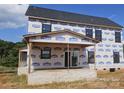 New construction of a two-story home with a covered porch, framed windows and brick foundation at Lot 100 Coppergate Dr, Salisbury, NC 28147