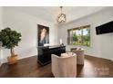 Bright home office features shiplap walls, hardwood floors and a large window at 1152 Grand Oak Dr, Waxhaw, NC 28173