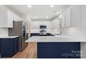 Bright kitchen featuring stainless appliances, custom cabinets and stylish countertops at 130 Valley Glen Dr, Troutman, NC 28166