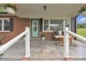 Inviting front porch with seating, a decorative rug, and an attractively painted front door at 1770 Nc 90 W Hwy, Taylorsville, NC 28681
